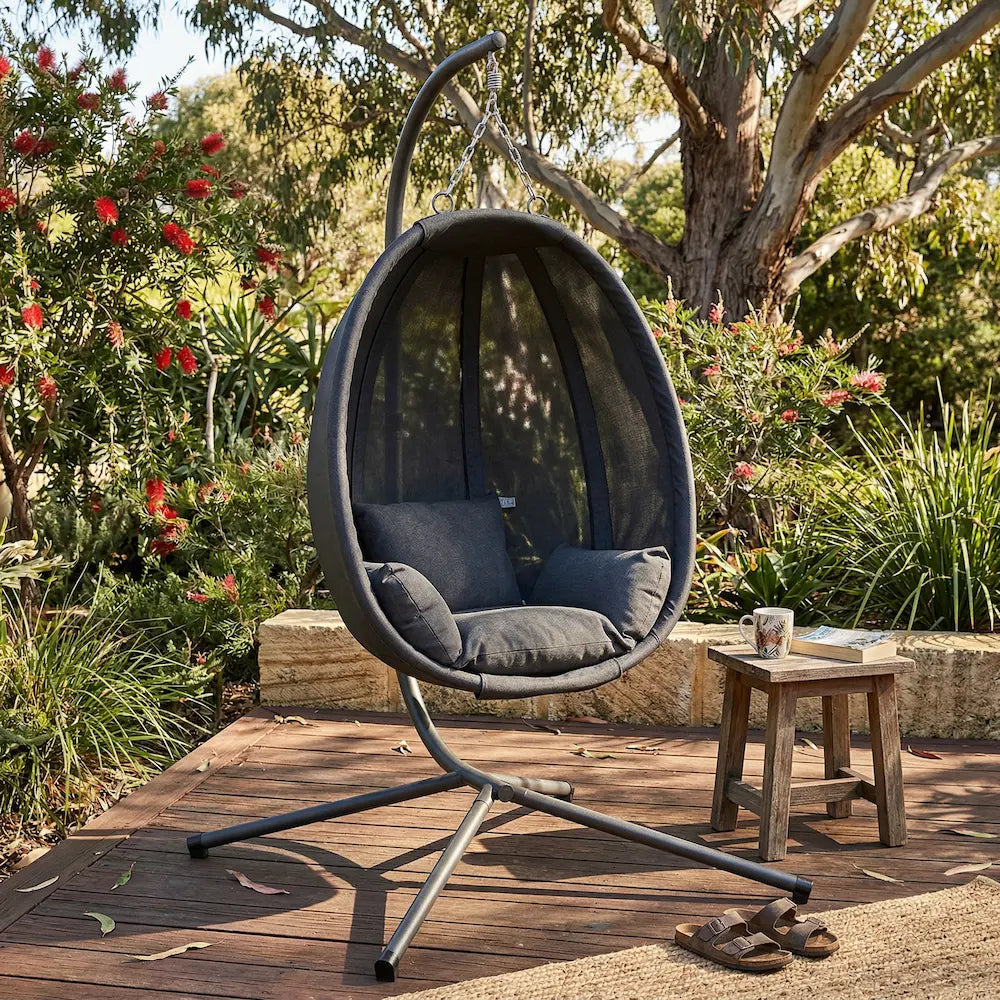 Outdoor hanging egg chair in australian garden patio