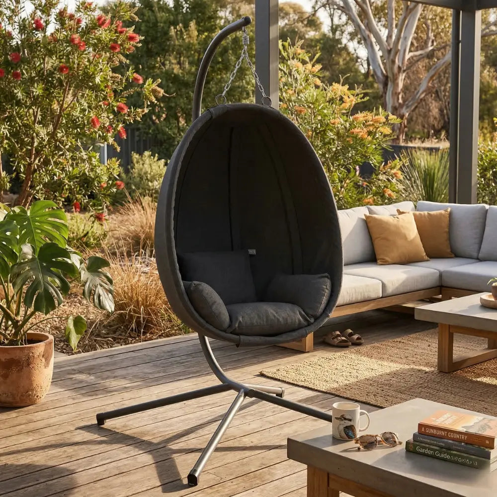 Anthracite Hanging Egg Chair with Stand and Cushion on Patio